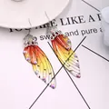 Elegante lange Ohrringe mit orangefarbenem Schmetterlingsflügel und Strasssteinen - Silber - Orange Strass