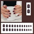 Close-up of dark brown short round press-on nails in glossy finish, 24pcs set display - Jujube Red (C010)