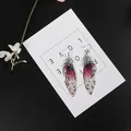 Elegante Ohrhänger mit lila Schmetterlingsflügeln und glitzernden Strasssteinen für Damen - Silber Basis Lila Zirkonia