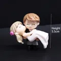 Handcrafted miniature wedding couple figurine with bride in white dress and groom - Bride Carrying Couple (Black and White)
