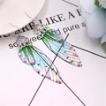 Elegante Schmetterlingsflügel-Ohrringe mit blau-grünem Verlauf und funkelnden Strasssteinen - Silber mit grünem Strass