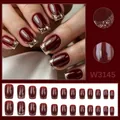 Close-up of elegant cherry red press-on nails with gold glitter tip details - 24 Pcs/Set / Cherry Red Gold Edge Shimmer (W3145)