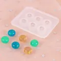 Gedetailleerde weergave van een siliconen mal met 6 gaten en glitterende harskralen - Rechthoekige Ronde Stijl (50-1357) / 16mm