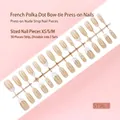 Detailweergave van 30 Franse nageltips met strikken op strip, in nude kleurset - Bowknot French Style (S198-T) / 30-delige Set (XS/S/M Maten) / Nude Tone Bowknot
