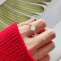 Detail of a handcrafted colorful tourmaline beaded ring with a square moonstone center. - Colorful Tourmaline Ring
