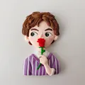 Detailed view of boy figurine cake topper holding a red rose for Valentine's Day - Polymer Clay Rose Boy
