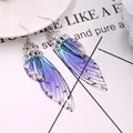 Elegante blau-violette Schmetterlingsflügel-Ohrringe mit schimmernden Strasssteinen - Silber-Blauer Strass