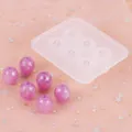 Detailweergave van een 6-gaats siliconen mal voor hars met paarse kralen op roze gaas. - Ovale Stijl (50-1361)