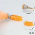 Professional stainless steel piping nozzle 52-39 creating orange ruffled icing patterns - 52-39