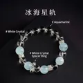 Natürliches weißes Quarz- und blaues Aquamarin-Perlenarmband mit Metall-Abstandshaltern - Eismeer-Sternenspur-Stil / Blau und Weiß