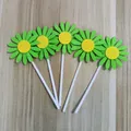 Five pieces of green and yellow non-woven sunflower cake toppers on white sticks - Green