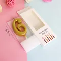 Detail of gold number 6 birthday candle for cake decoration, 5.2cm height with white box - Number 6 / Single Piece / Gold