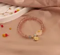 Elegant New Chinese style bracelet featuring pink strawberry quartz and moonstone beads with gold charms - Rose Style