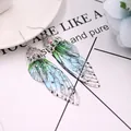 Elegante lange Schmetterlingsflügel-Ohrringe mit grün-blauem Farbverlauf und Glitzer-Deko - Silberfolie - Grün