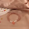 Handmade natural strawberry quartz bead bracelet with elegant white moonstone accents - Peach Style