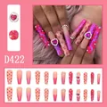 Close-up of pink gradient press-on nails with 3D flowers and heart diamond details - 24 Pcs/Set / Pink Gradient Embossed Flower Heart Diamond Monogram Style (D422)