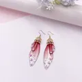 Elegante lange Schmetterlingsflügel-Brautohrringe mit rosa Verlaufsharz und Kristallen - Gold - Rosaroter Strass