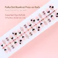 Elegante nude roze kunstnagels met hart- en strikmotief, 30 stuks per strip voor nagelkunst - Transparant Nude Roze met Zwarte Strik