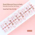 Elegant peach pink floral press-on nails set containing 30 pieces in sizes XS, S, and M - New Chinese Nude Pink White Floral Style (S049-T) / 30 Pieces/Strip (Mixed XS/S/M Sizes)