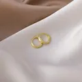 Close-up of minimalist gold-plated small huggie hoop earrings on silk fabric - 3# 16423 Inner Diameter 1.2cm / Gold