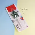 Vista de una vela de cumpleaños estrella verde de 4,6 cm en su embalaje original. - Estrella Con Strass / Verde