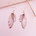 Elegant pink cicada wing earrings decorated with sparkling rhinestones and gold hooks. - Rhinestone Decoration / Gray