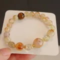Detailansicht eines Naturkristall-Armbands mit gelben Turmsteinen und Tigerauge-Perlen. - Natürlicher Citrin & Tigerauge