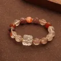 Elegantes Naturstein-Perlenarmband mit bunten Edelsteinen und einem rohen Bergkristall - Mehrschatz Neunschwänziger Fuchs Armband / bunt