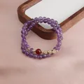 Close-up detail of double-strand purple amethyst beaded bracelet with sunstone accents - Dark Amethyst Red Agate Double Layer Bracelet