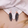Elegante schwarze Zikadenflügel-Brautohrringe mit Goldakzenten und Kristallen - Roségold / Schwarz