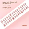 Set of 30 pink gradient press-on nails featuring gold patterns, available in sizes XS S M - Pink Gradient Laurel Line Style (S119-T) / 30 Pieces/Strip (Includes XS/S/M Sizes)