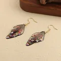 Vintage butterfly wing drop earrings with colorful rhinestone accents and gold hooks. - New Rhinestone Design / Red