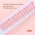Macro view of 30 pieces gradient pink French style press-on nails with rhinestone details - French Rhinestone Gradient Nude Bar (SD001-T) / 30 Packs