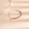 Elegante bracciale di perline con pietre rosa e bianche e ciondolo a farfalla dorato - Abito ufficiale antico