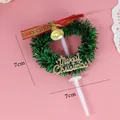 Decoración mini para tartas corona de Navidad 7cm con lazo rojo y cascabel dorado - Guirnalda Lazo Letra / Paquete de 10