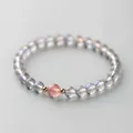 Grey moonstone beaded bracelet featuring a single pink strawberry quartz accent bead - Rose Quartz-Moonstone
