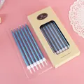 Twelve pack of elegant metallic blue pencil candles displayed in a kraft paper gift box - 12 PCS / Blue
