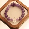 Natural 12mm purple amethyst bead bracelet featuring a clear quartz point in a wooden tray - Tower Point White Crystal Style / Purple
