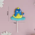 Cute blue dinosaur cake topper on yellow duck ring for birthday party - Blue Dinosaur with Duck Swim Ring