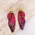Exquisite detail view of handmade butterfly wing earrings with gold foil and purple gradient - Gold Foil Rose Decor / Dreamy Red