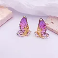 Elegantes pendientes 3D con alas de mariposa en morado degradado y detalles de cristal - Base dorada / Púrpura