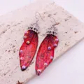 Elegant red shimmering butterfly wing earrings with rhinestones on textured stone - Silver Hook / Dreamy Red