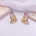 Elegantes pendientes de alas de mariposa en degradado rosa con cristales dorados finos - Base dorada / Champán
