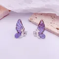Pendientes de tuerca con alas de mariposa en degradado púrpura y detalles plateados - Base de Plata / Estilo de Purpurina / Azul