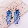 Blue butterfly wing drop earrings with iridescent glitter and rhinestone accents - Rose Gold Hook / Dreamy Blue