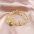 Double-strand handmade bracelet featuring natural citrine cat carving and moonstone beads - Flower Plaque Style