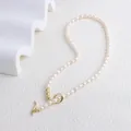 Detail of freshwater pearl necklace with golden bean beads and elegant OT clasp closure - Necklace (5#)