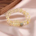 Natural citrine double strand bracelet featuring a carved cat charm and moonstone bead - Pixiu Style