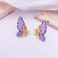 Pendientes de alas de mariposa en degradado morado bañados en oro con piedra clara - Gold Base / Glitter Style / Azul