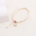Close-up of a natural freshwater pearl bracelet with a rectangular zircon pendant. - White Square Rhinestone
